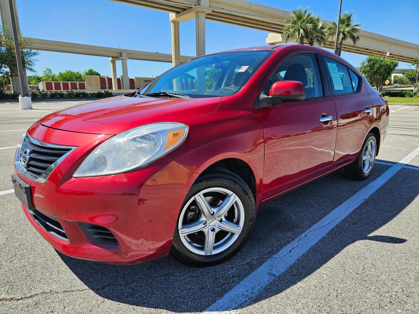 2012 Red /Black Nissan Versa (3N1CN7AP8CL) , located at 5005 Telephone Rd., Houston, TX, 77087, (713) 641-0980, 29.690666, -95.298683 - Photo#1